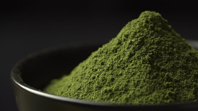 Japanese organic matcha green tea powder in the black bowl preparing, Organic product from the nature for healthy with traditional style