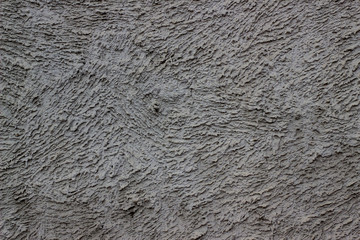 Texture gray plastered wall for background. Rough cement wall plaster. Facade stucco background. The exterior of the building. Cement-sand cement plaster