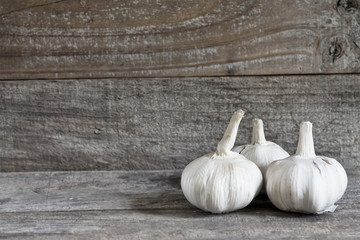 Garlic on wood background