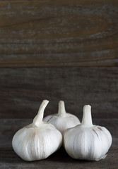 Garlic on wood background