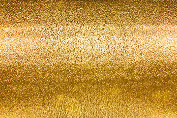 Shiny metal gold foil texture for background.