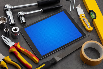 Household tools and tablet with grid screen concept
