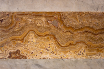 Marble wall in brown and orange colors 