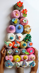 Impression Christmas decoration, top view woman hand making simple Christmas tree