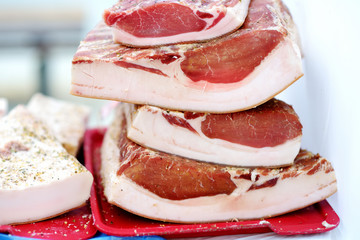 Selection of assorted home made meats, jerky and sausages on a farmer's market in Vilnius, Lithuania.