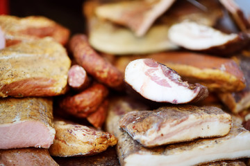Selection of assorted home made meats, jerky and sausages on a farmer's market in Vilnius, Lithuania.