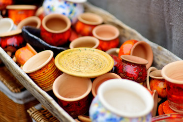 Obraz na płótnie Canvas Ceramic dishes, tableware and jugs sold on Easter market in Vilnius, Lithuania