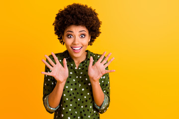 Photo of funky dark skin curly lady hold arms spread fingers big eyes excited astonished...