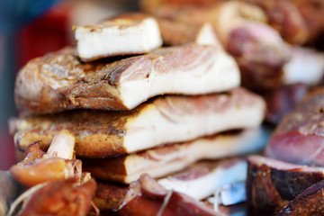 Selection of assorted home made meats, jerky and sausages on a farmer's market in Vilnius, Lithuania.