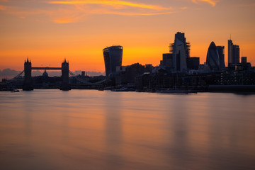 Long exposure, silhouette of London cityscape with river Thames