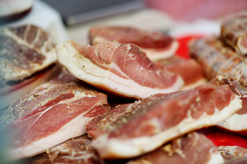 Selection of assorted home made meats, jerky and sausages on a farmer's market in Vilnius, Lithuania.