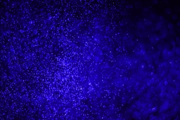 blue huge amount flying shining glitters bokeh texture - fantastic abstract photo background