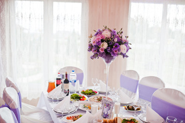 Beautiful wedding purple set decoration in the restaurant.