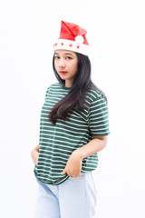 portrait of a young asian woman wearing a santa hat with a white isolated background