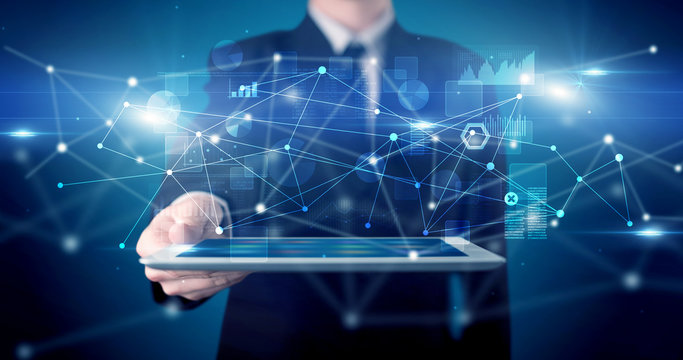 Elegant hand holding tablet with virtual database and network concept