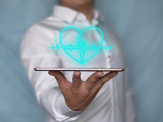 The concept of health safety. Insurance related icon graphic interface showing heart and cardiogram.
