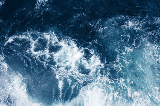 Top view on blue ocean waves. Nature background. © Olga Zarytska