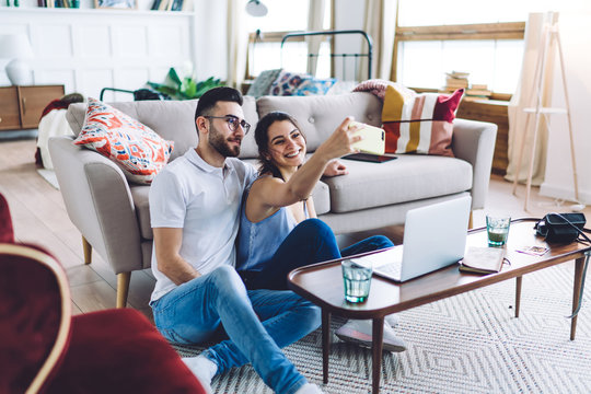 Harmonious Couple Taking Selfie At Home