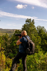 man tourist photographer on a mountain.