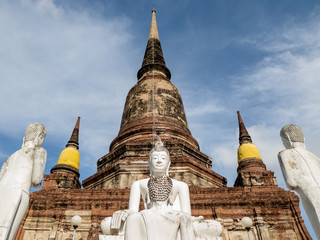 Fototapeta na wymiar Pagoda and Buddha statues at Wat Yai Chai Mongkhon temple of archaeological park in Ayutthaya Thailand.