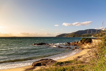 Coastal landscape beach and rocky coast.