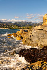 Coastal landscape beach and rocky coast.