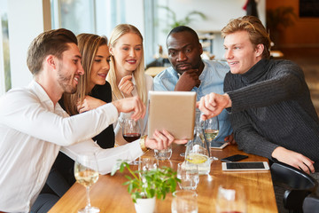 Young people are looking at a tablet computer