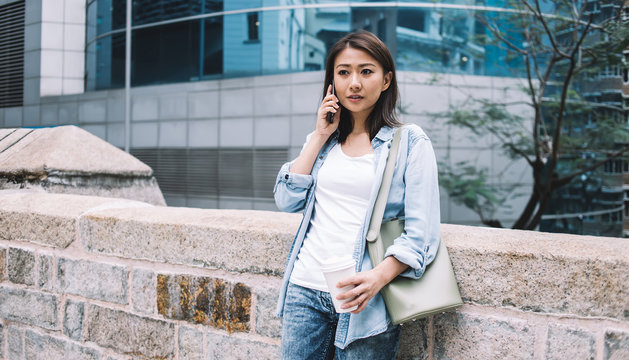 Attractive Asian Woman Speaking On Phone