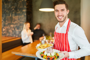 Waiter on temp served Greek salad