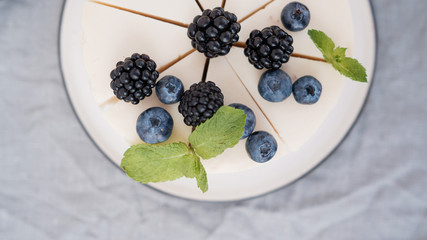 cheesecake with blueberries and blackberries. top view