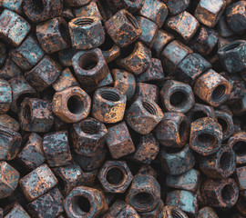 close up of rusty screw nuts and bolts