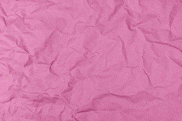 Pink crumpled craft paper. Paper surface texture.