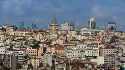 Naklejka premium Galata Tower and Mosque dome silhouette with Bosphorus landscape in Golden Horn of Istanbul city