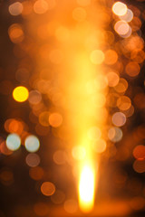 Sparkler with blurred busy city light background