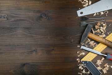 carpentry tools on wooden background with copy space