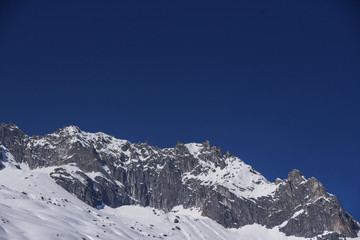 scenic view of snowcapped mountains against clear blue sky