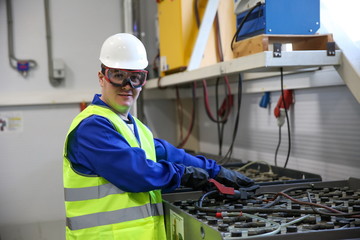 worker man in the battery charging room