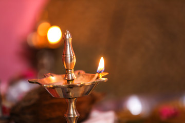 Traditional oil lamp with flame 