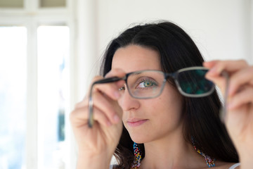 woman playing with glasses