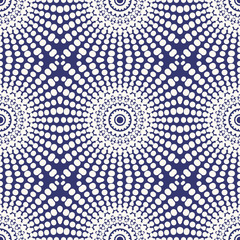 Seamless pattern with decorative circles in the style of a mandala. Vector illustration.