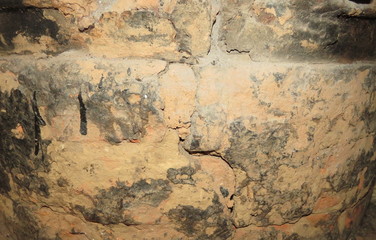 image of an old brick wall with uneven masonry