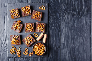 Chocolate Peanut Butter Bars topped with pretzel