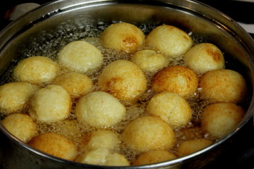Cottage cheese balls. Small balls of freshly baked homemade cottage cheese fried hot oil. Freshly made donuts from cottage cheese
