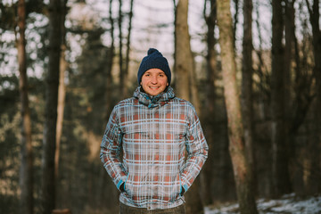 Portrait of a young man enjoying the first snow of the year.