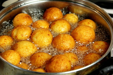 Cottage cheese balls. Small balls of freshly baked homemade cottage cheese fried hot oil. Freshly made donuts from cottage cheese