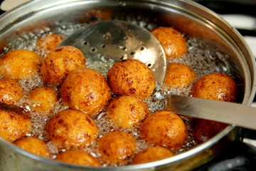 Cottage cheese balls. Small balls of freshly baked homemade cottage cheese fried hot oil. Freshly made donuts from cottage cheese