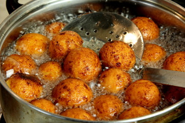 Cottage cheese balls. Small balls of freshly baked homemade cottage cheese fried hot oil. Freshly made donuts from cottage cheese