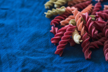 d vegetarian pasta on a dark classic blue background copy space