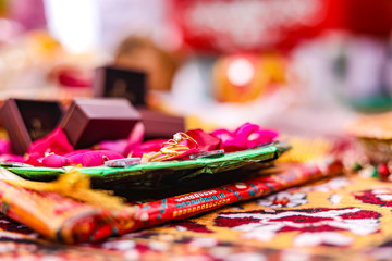 engagement ring in red rose decorative plate 