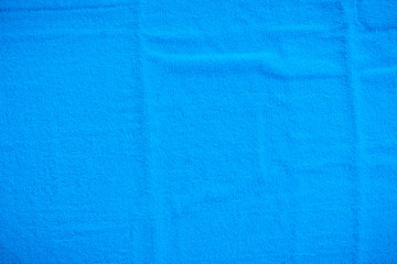 Blue towel, cloth, fabric surface backgrounds/Textures. Soft image.